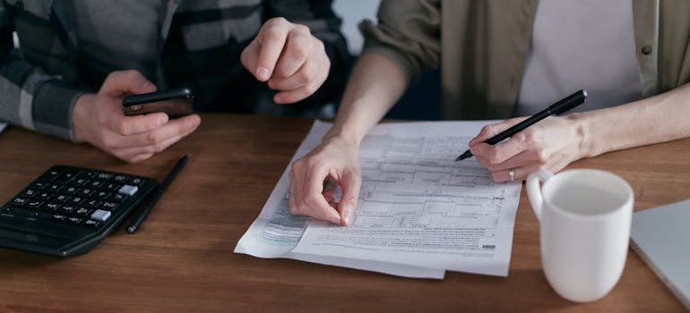 couple discusning their finances, talking about your budget when moving in with a partner is very important