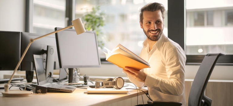 Man smiling in an office