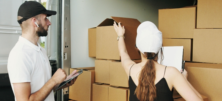 Man and woman delivering boxes