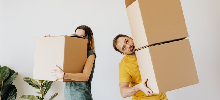 a couple with moving boxes