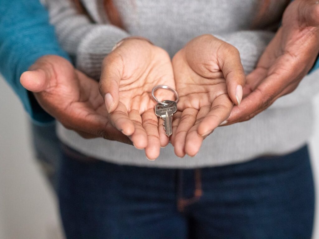 a couple having a key to their new home