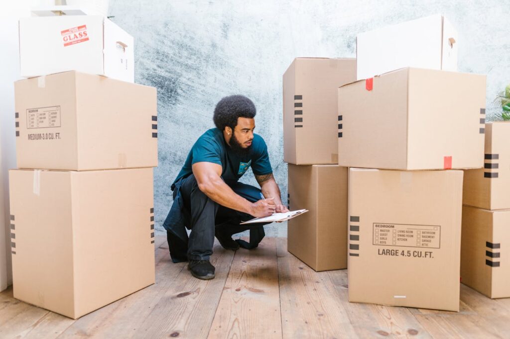 A mover labeling and checking boxes 