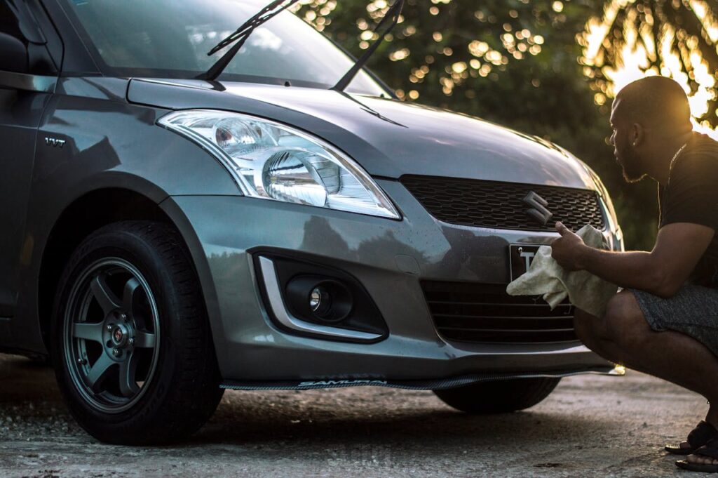a man cleaning his car