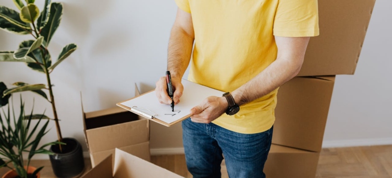 a man following a moving checklist when making a military move